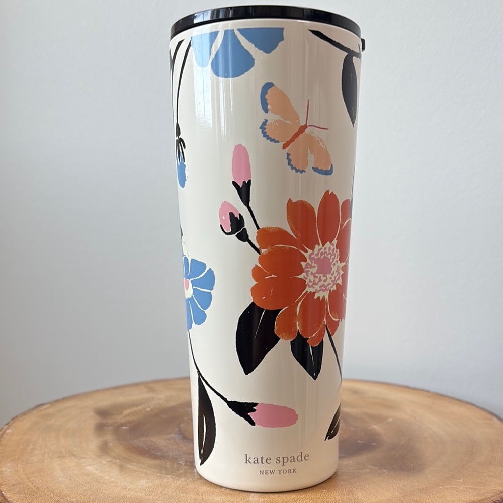 kate spade cream travel tumbler with pink and black floral accents